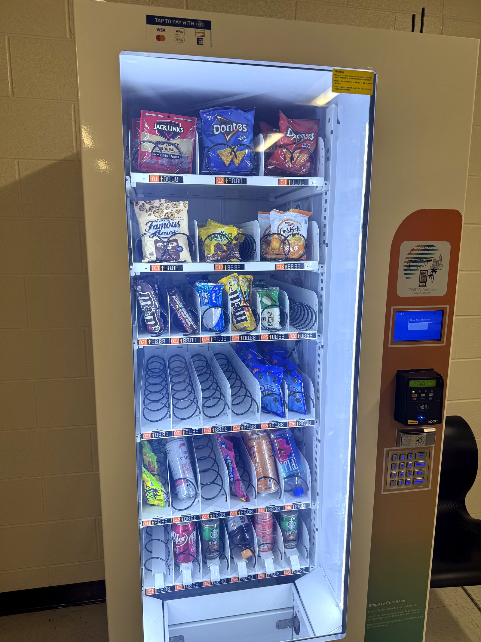 Coastal Vending 912 branded touchscreen vending machine installed at a Savannah business