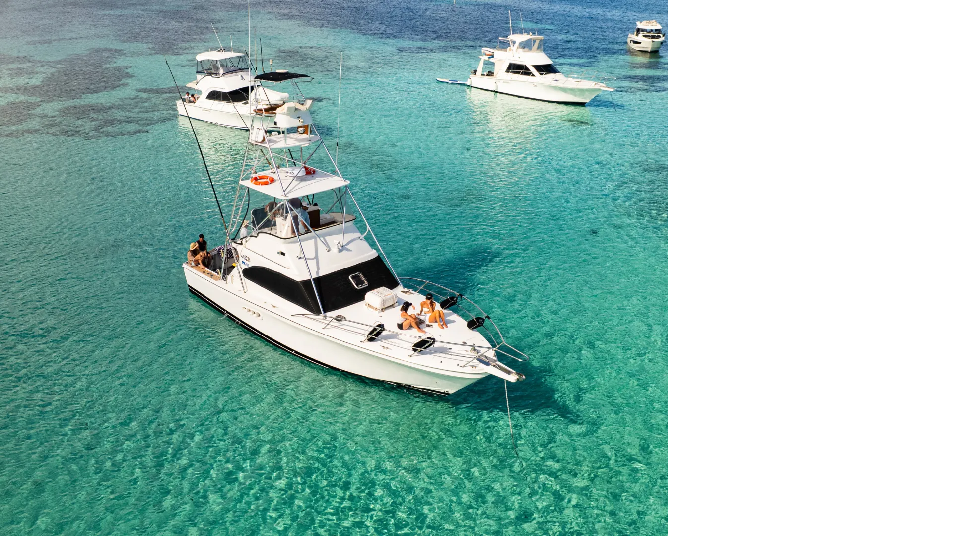 Aerial view of Game Time anchored among other boats in a Rottnest Island bay