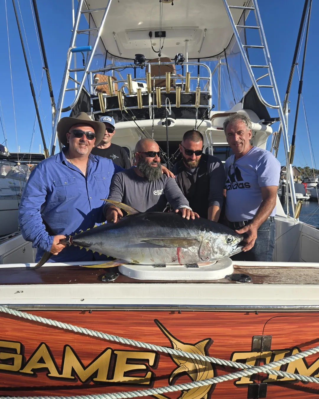 Group of anglers with a big tuna at the Game Time Charters transom