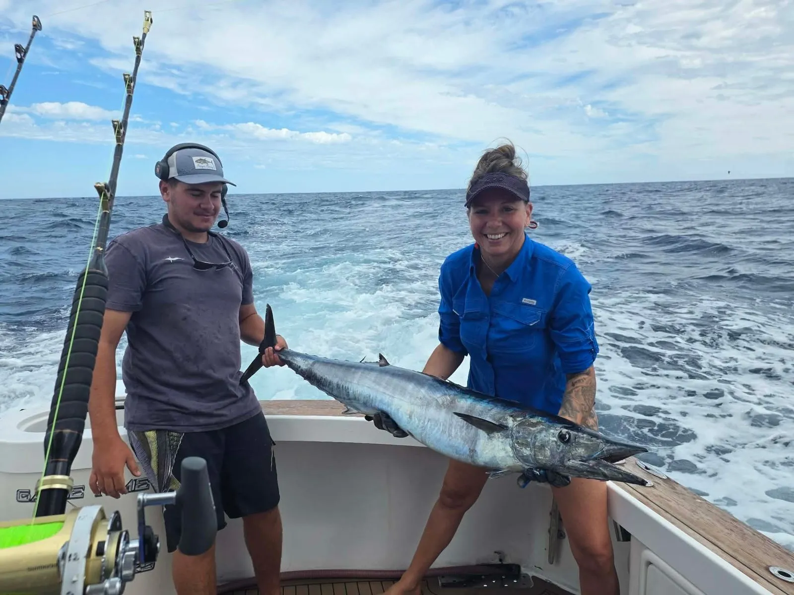 Game Time Charters crew holding a wahoo caught on a Perth game fishing charter
