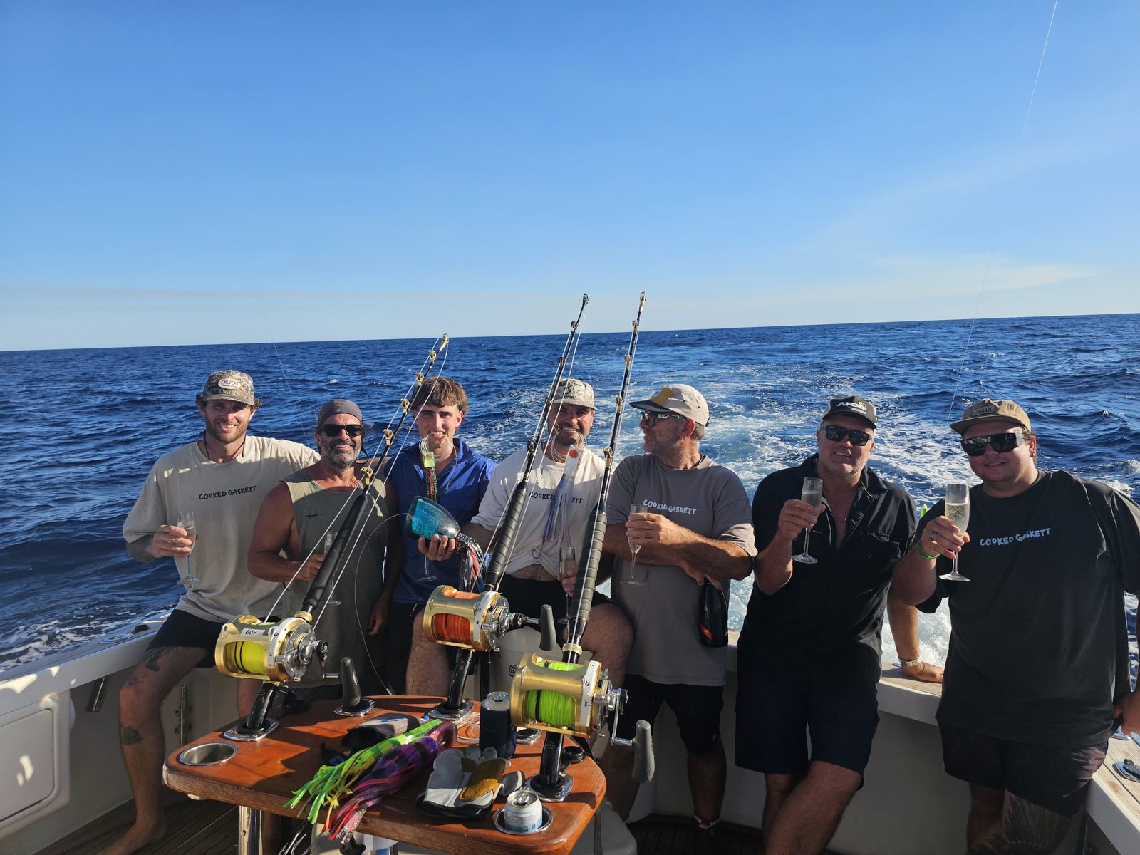 Group of anglers on deck with rods set on a Game Time Charters game fishing charter