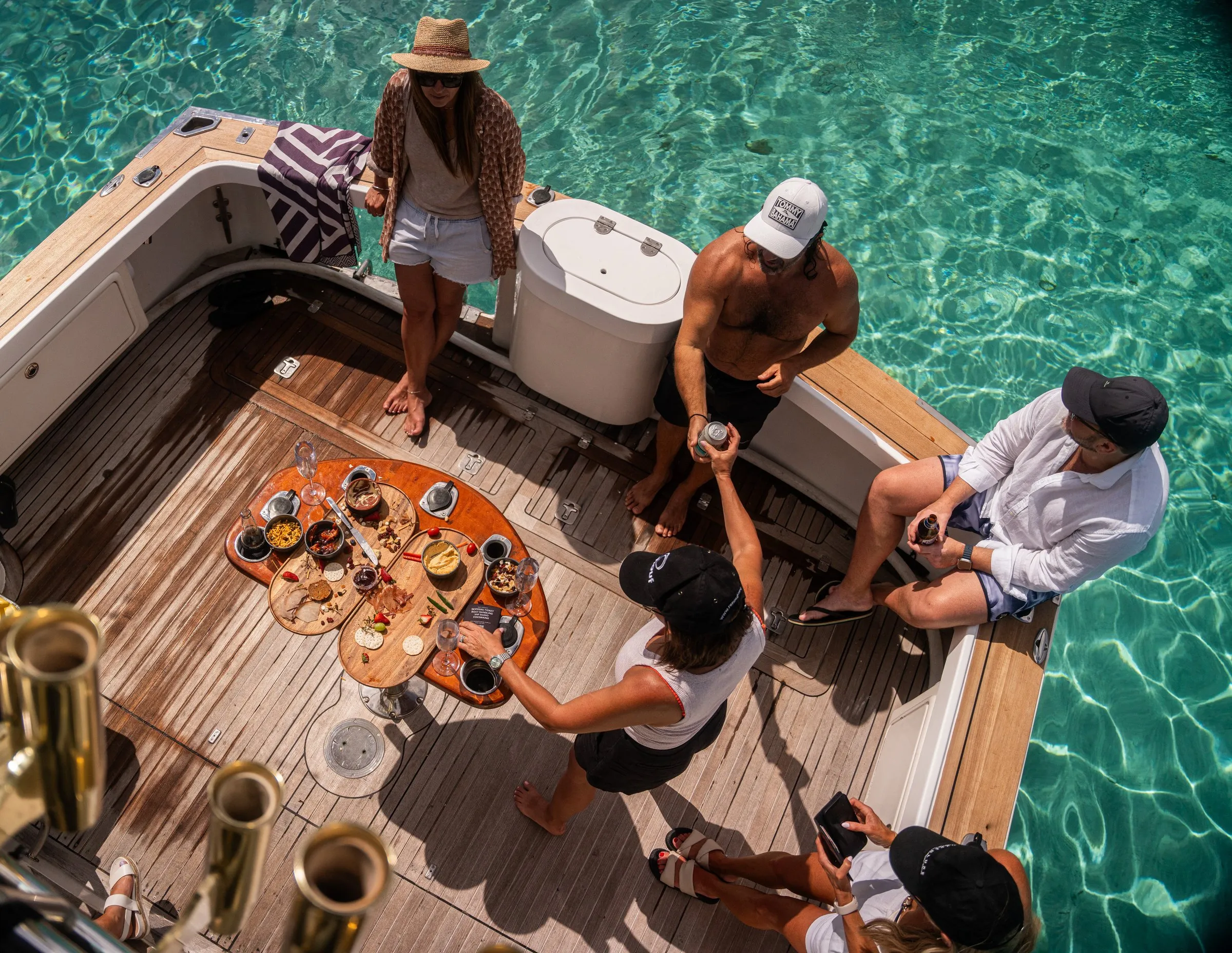 Guests sharing a platter on the back deck of Game Time, seen from above