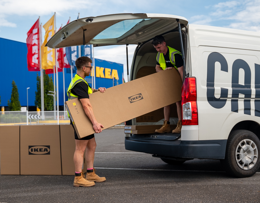 A Cargo Bear delivery driver picking up IKEA furniture delivery from IKEA Logan.