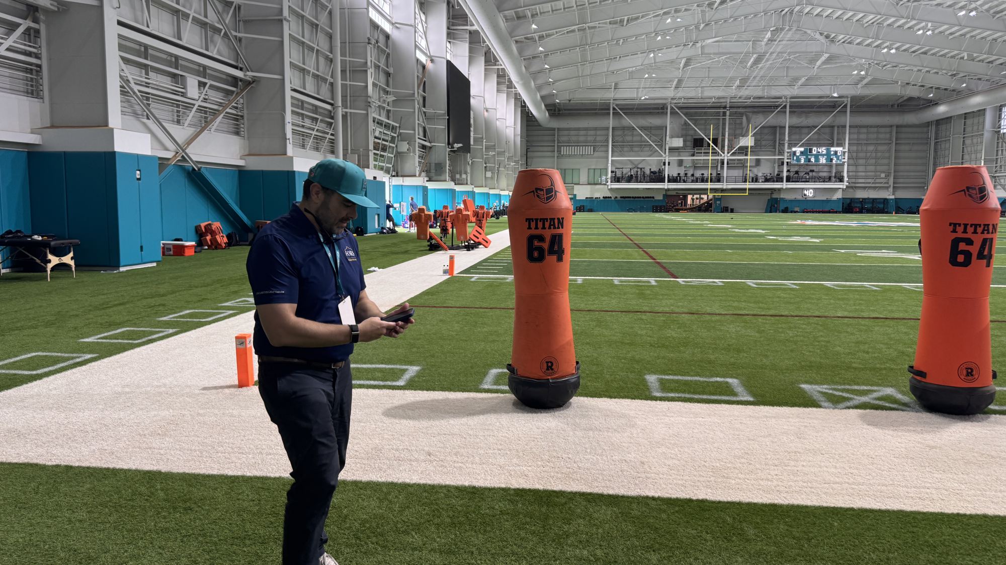A FORS attorney on the field inside an indoor NFL practice facility