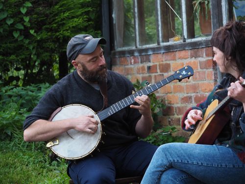 Playing 5 string banjo in the garden