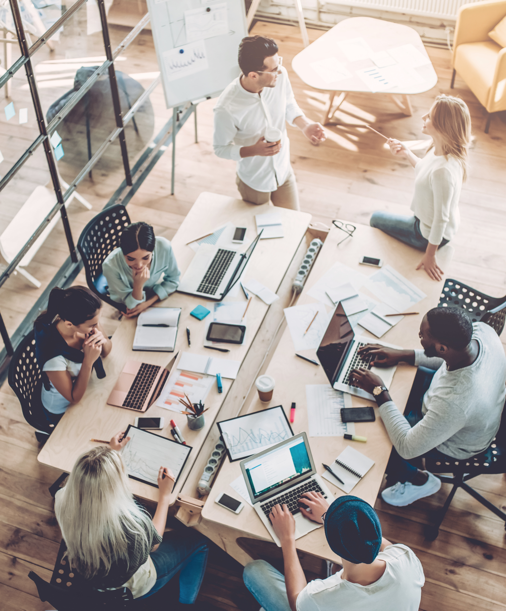 Employees sitting around a conference room table