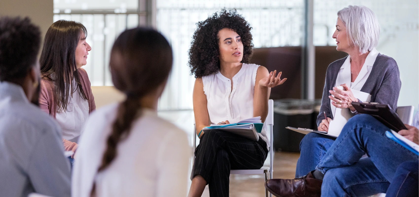 Homeowners association meeting between members with one member speaking.