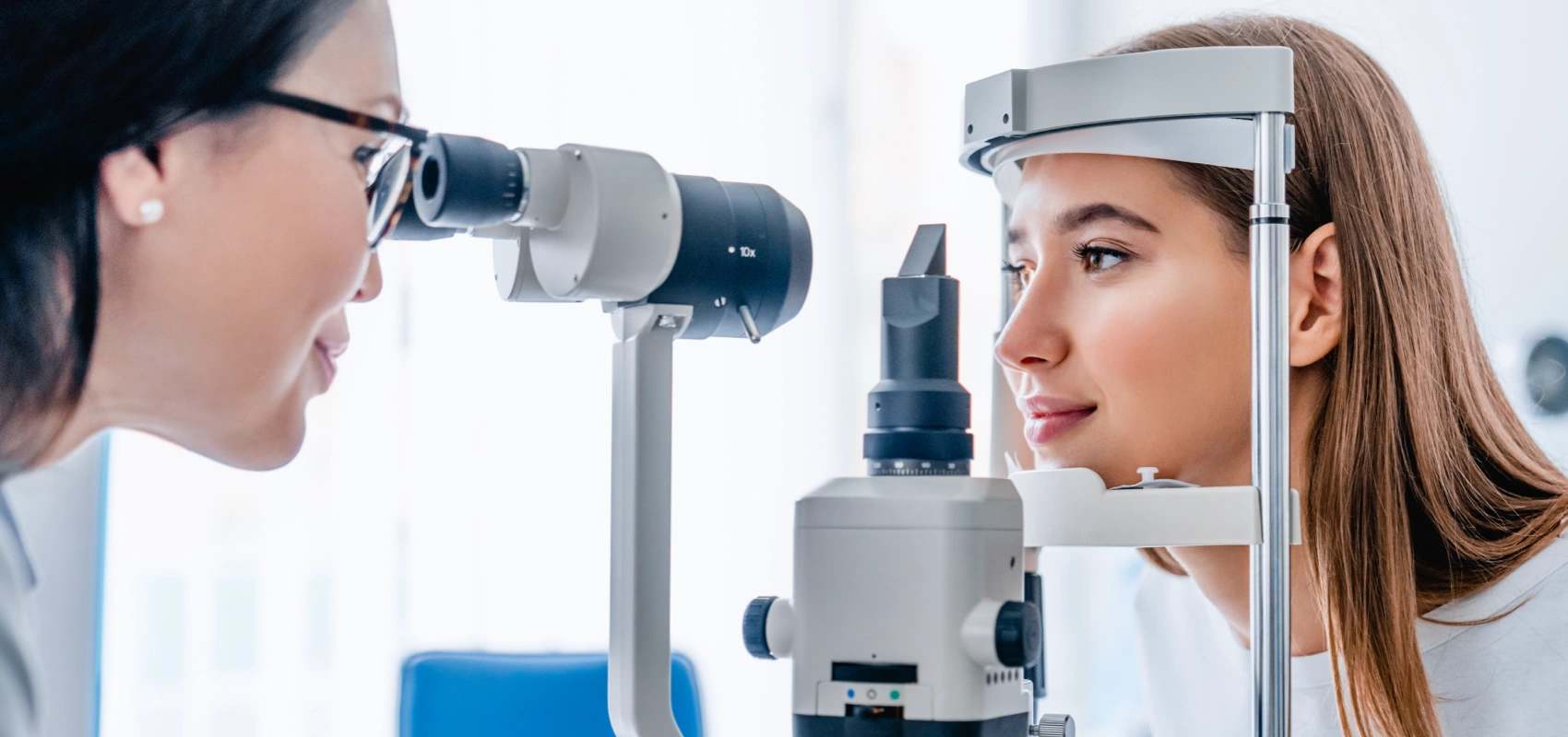 Optometry evaluation doctor looking at patient