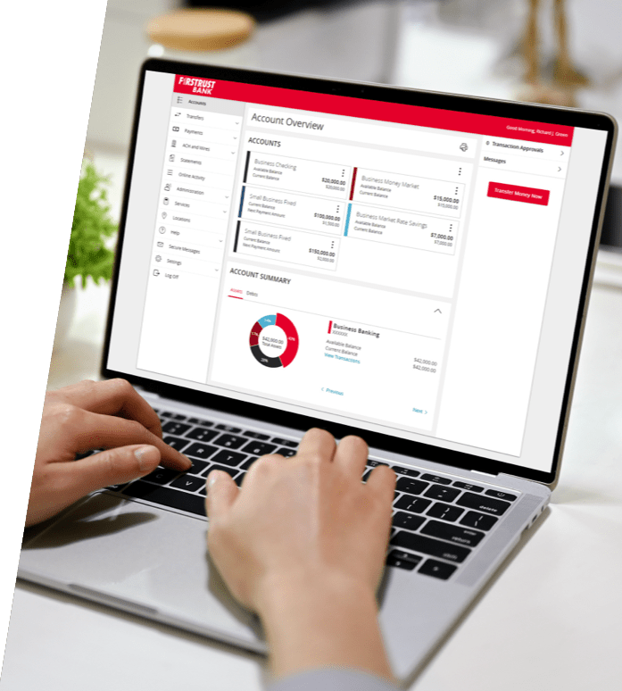Laptop with Firstrust online banking on the screen