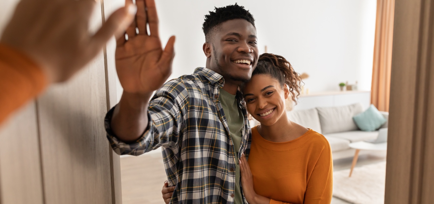Happy young couple in their new home.