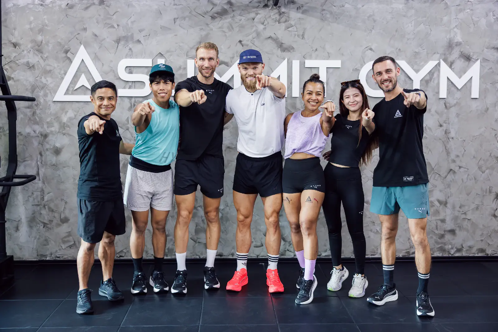 Group photo in front of the Summit Gym logo at the end of the Summit Performance Weekend in Hua Hin