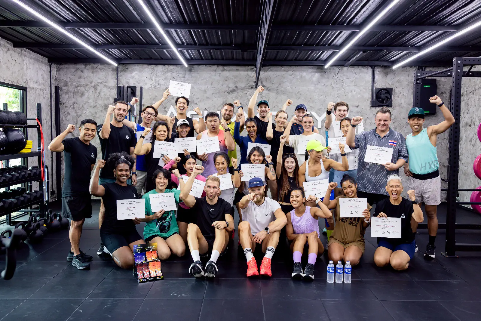Participants of the Summit Performance Weekend holding their certificates at Summit Gym Hua Hin