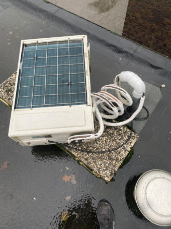 airco buiten op het dak
