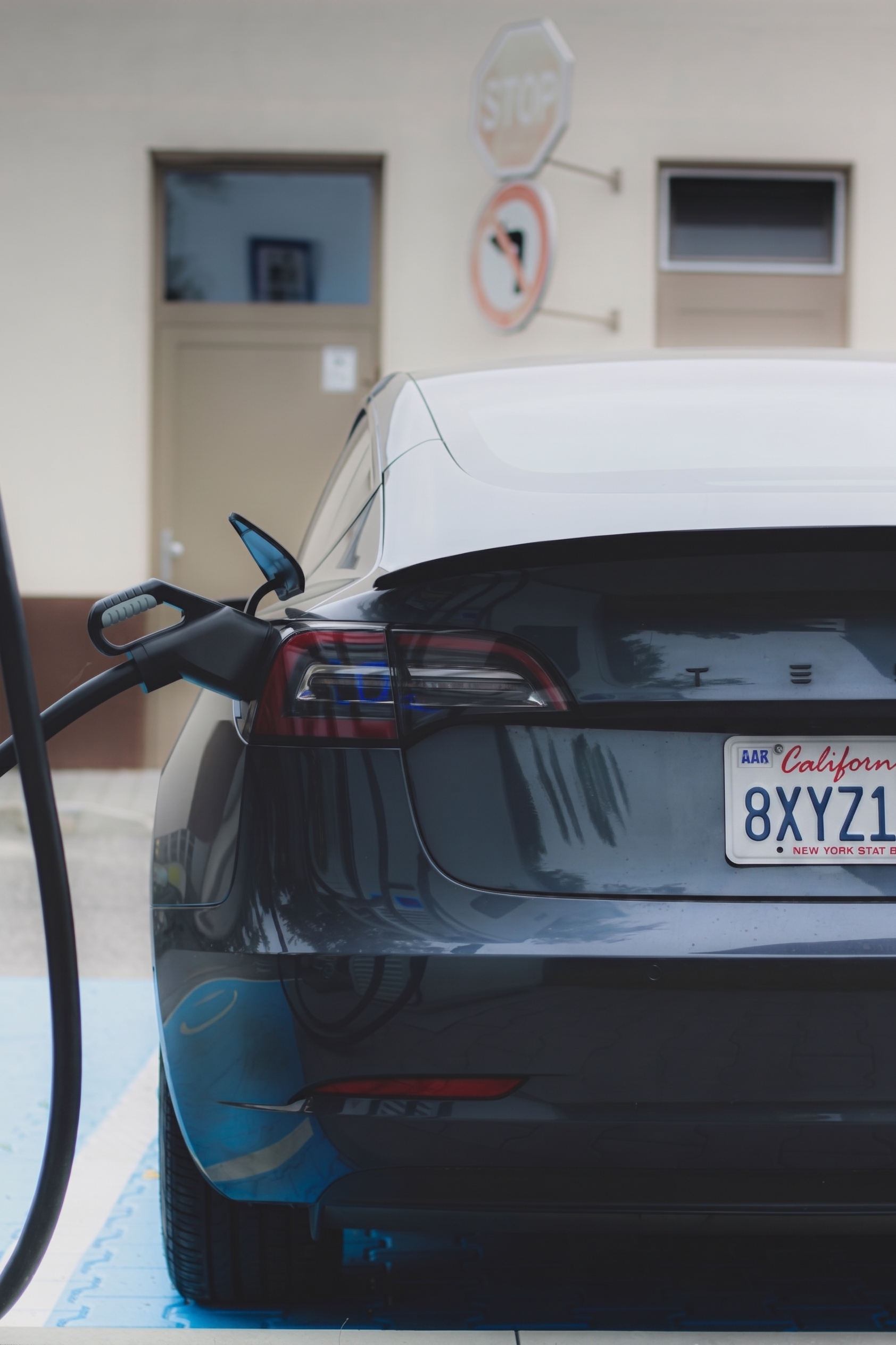 Electric vehicle plugged in at a fast charger