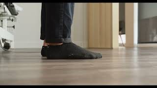 Standing with one foot in front of the other