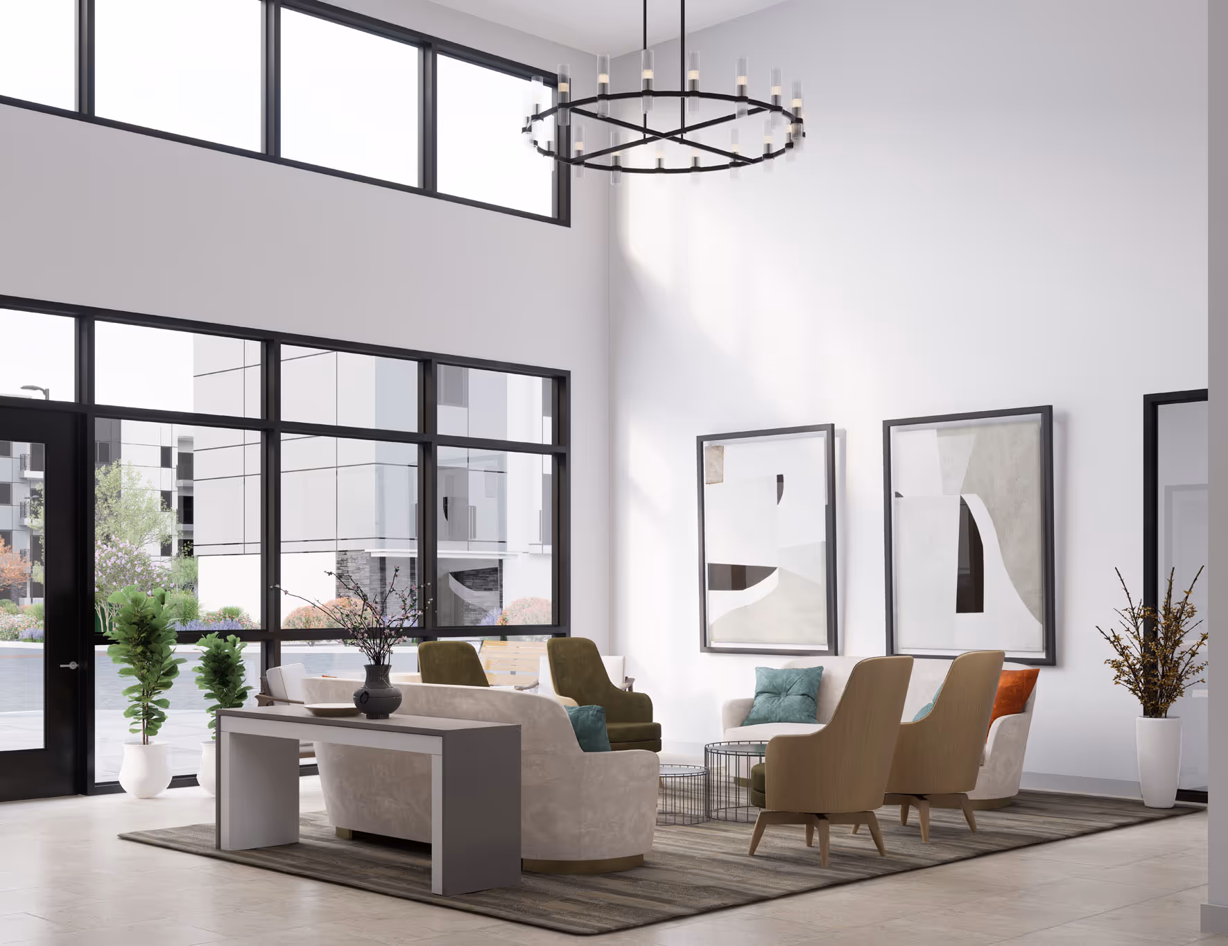 Grand and modern lobby with high ceilings, large windows, and a circular chandelier, welcoming residents to Avondale Commons in Avondale, AZ.