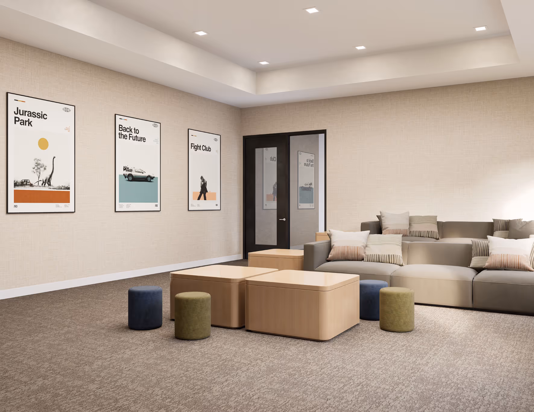 Resident media room with a large sofa, comfortable seating, and movie posters on the wall, providing entertainment at Avondale Commons in Avondale, AZ.