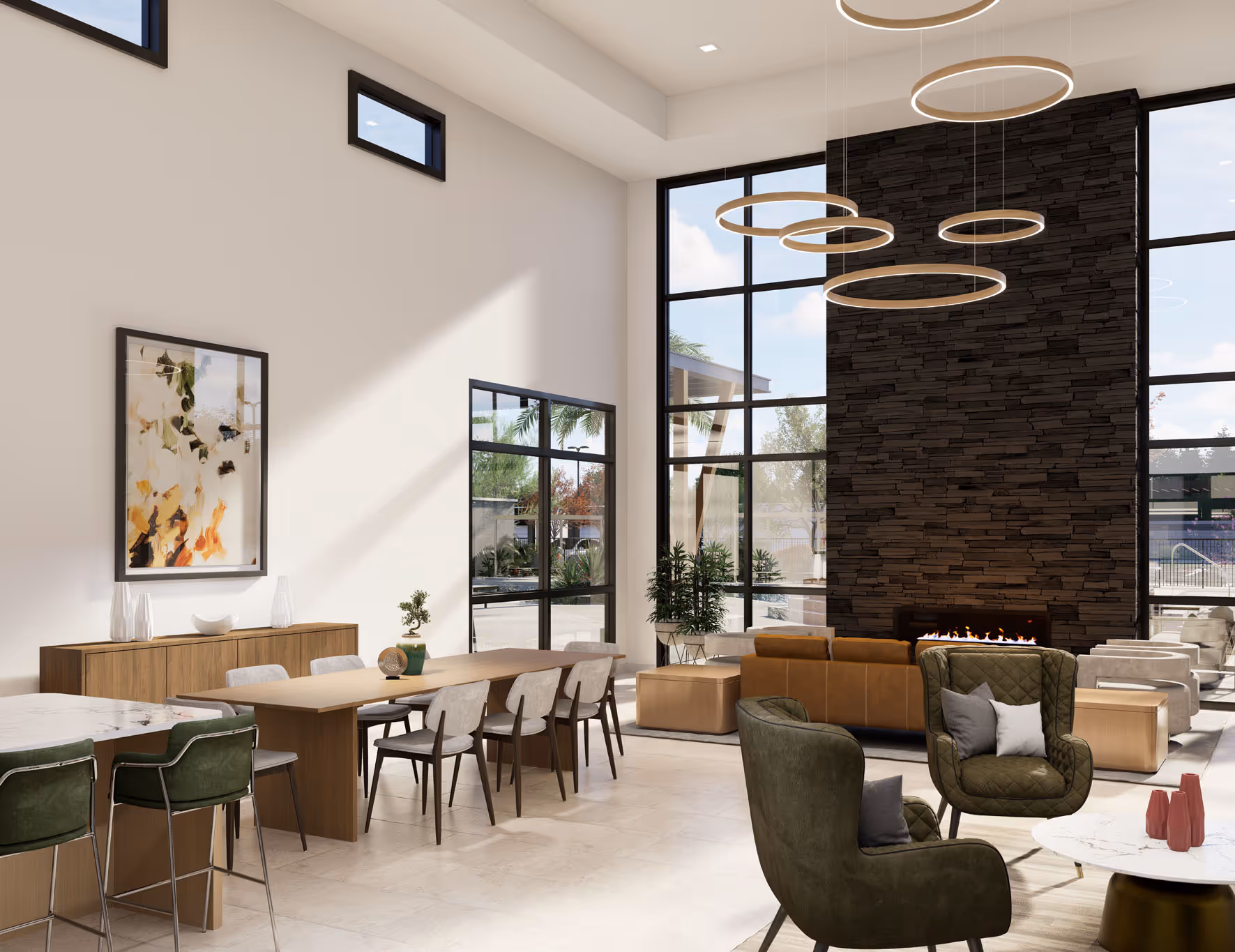 Spacious resident lounge with a fireplace, dining tables, and comfortable seating, providing a community hub at Avondale Commons in Avondale, AZ.