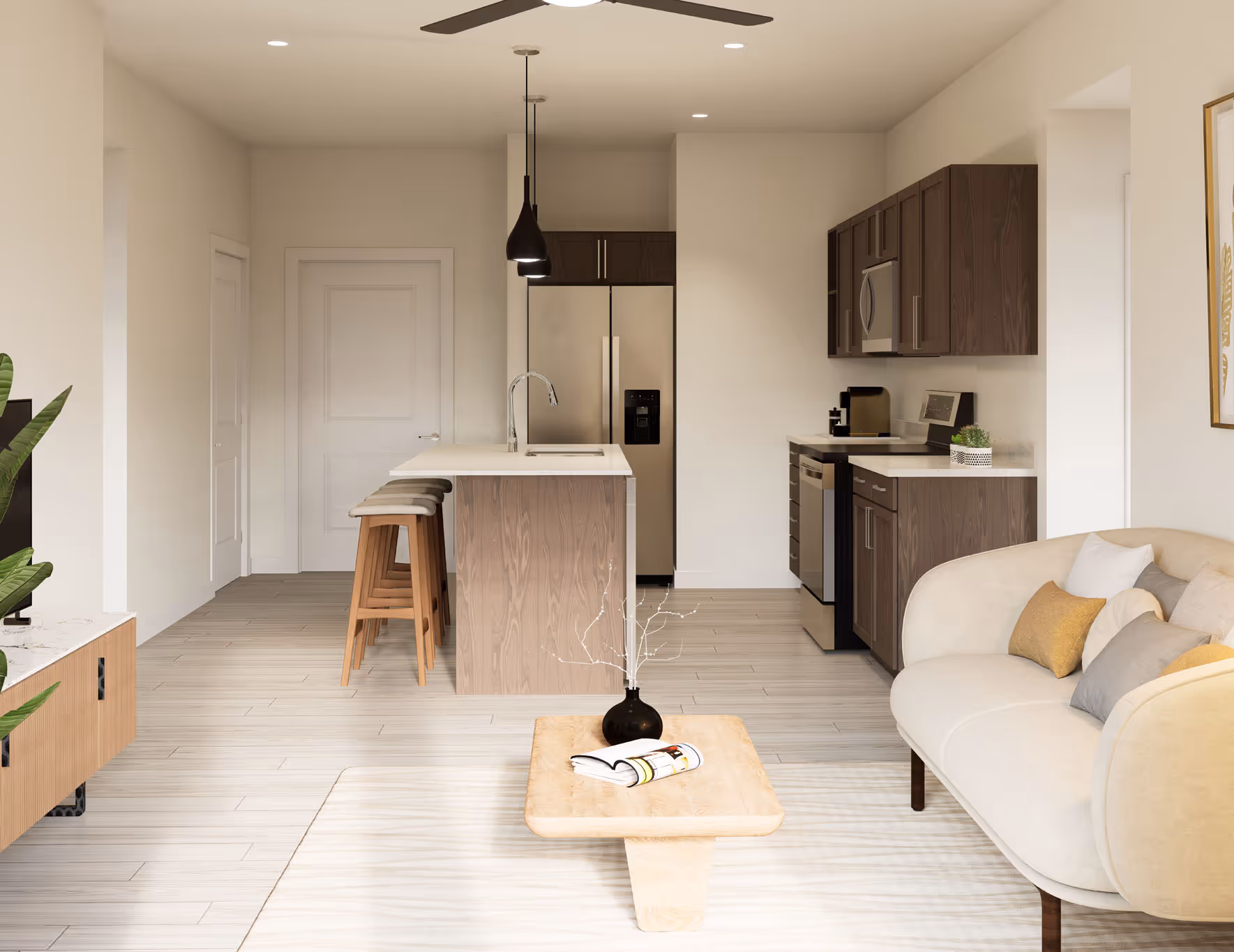 pacious living room with a neutral-toned sofa and modern coffee table, with a view of the kitchen and apartment entrance, at Avondale Commons in Avondale, AZ.