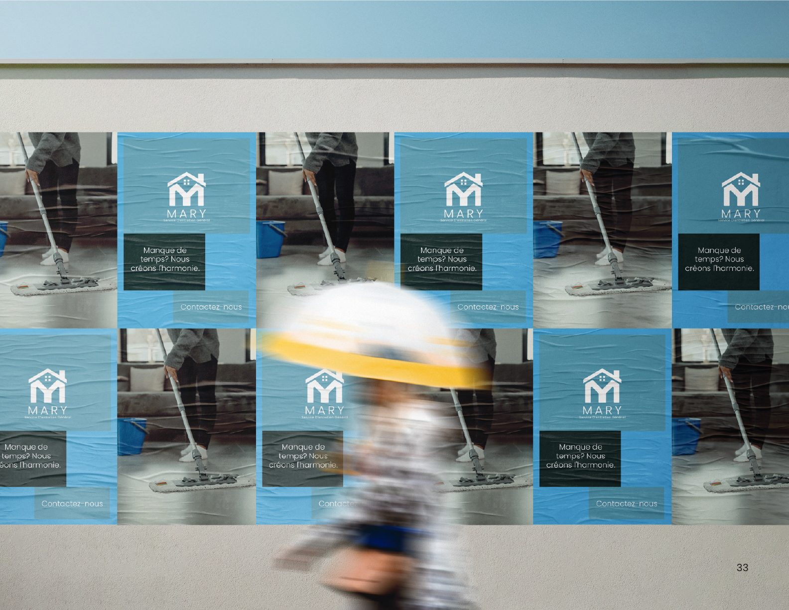 Mary logo poster on a street wall in blue tones