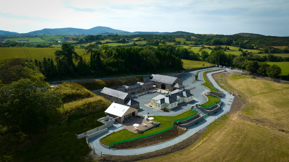 Aerial view of Crossnacreevy, showcasing residential housing amid open green spaces.