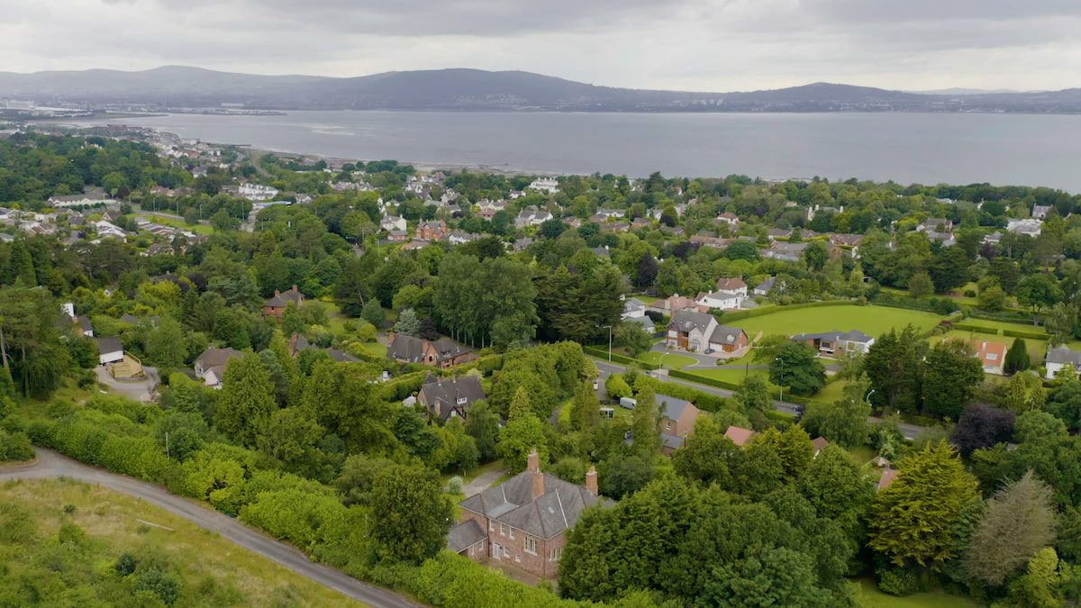 Elevated view of Cultra, featuring spacious properties set among greenery in a prestigious coastal area.