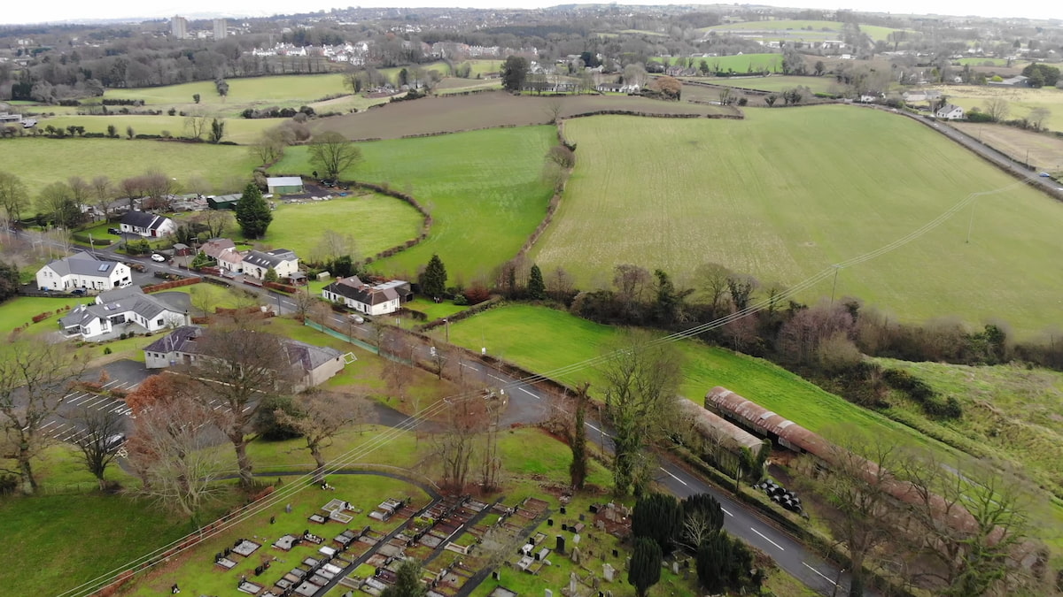 Aerial image of Hillhall Road, capturing scattered houses and open countryside on the edge of Lisburn.