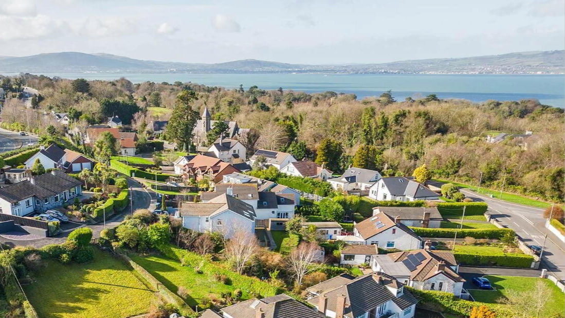 Coastal aerial view of Seahill, showing homes near the shoreline and a quiet residential setting.