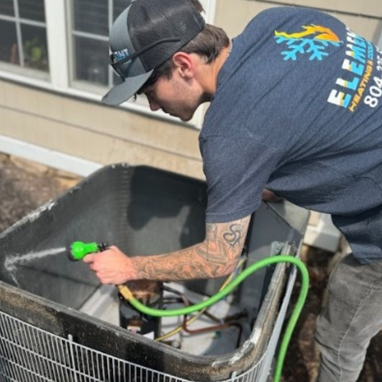 Spraying heat pump with water hose