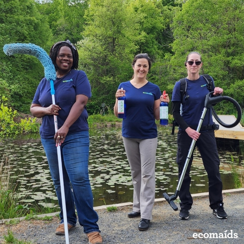 ecomaids cleaners posing for photo with cleaning equipment