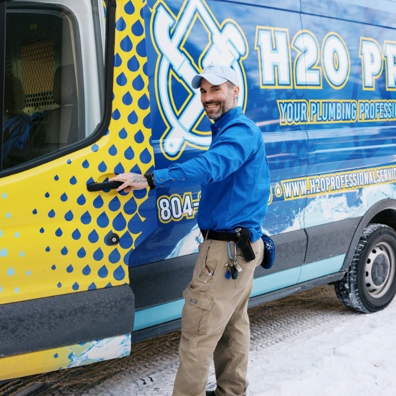 Jonathan Mullins opening the truck door to the H20 Pro Plumbing van