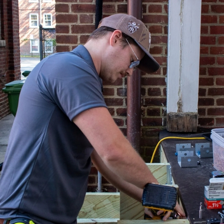 Young man drilling on a home improvement project