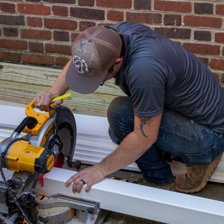 Man using circular saw to cut a piece of wood