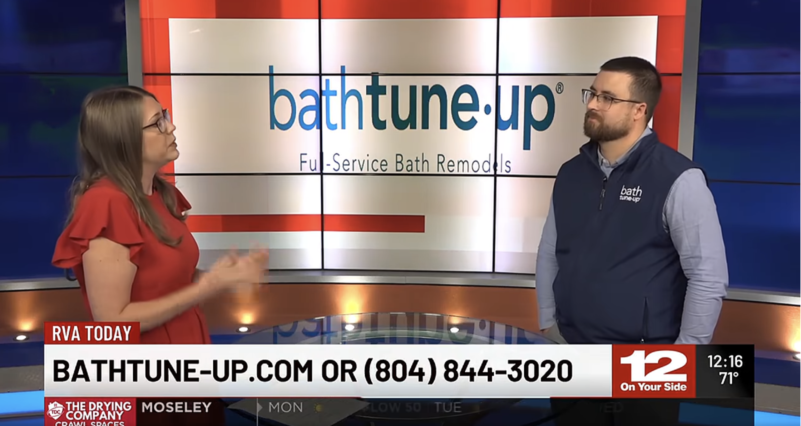 Image of newsroom with lady in red dress and Spencer Lambert wearing the bath tune-up vest