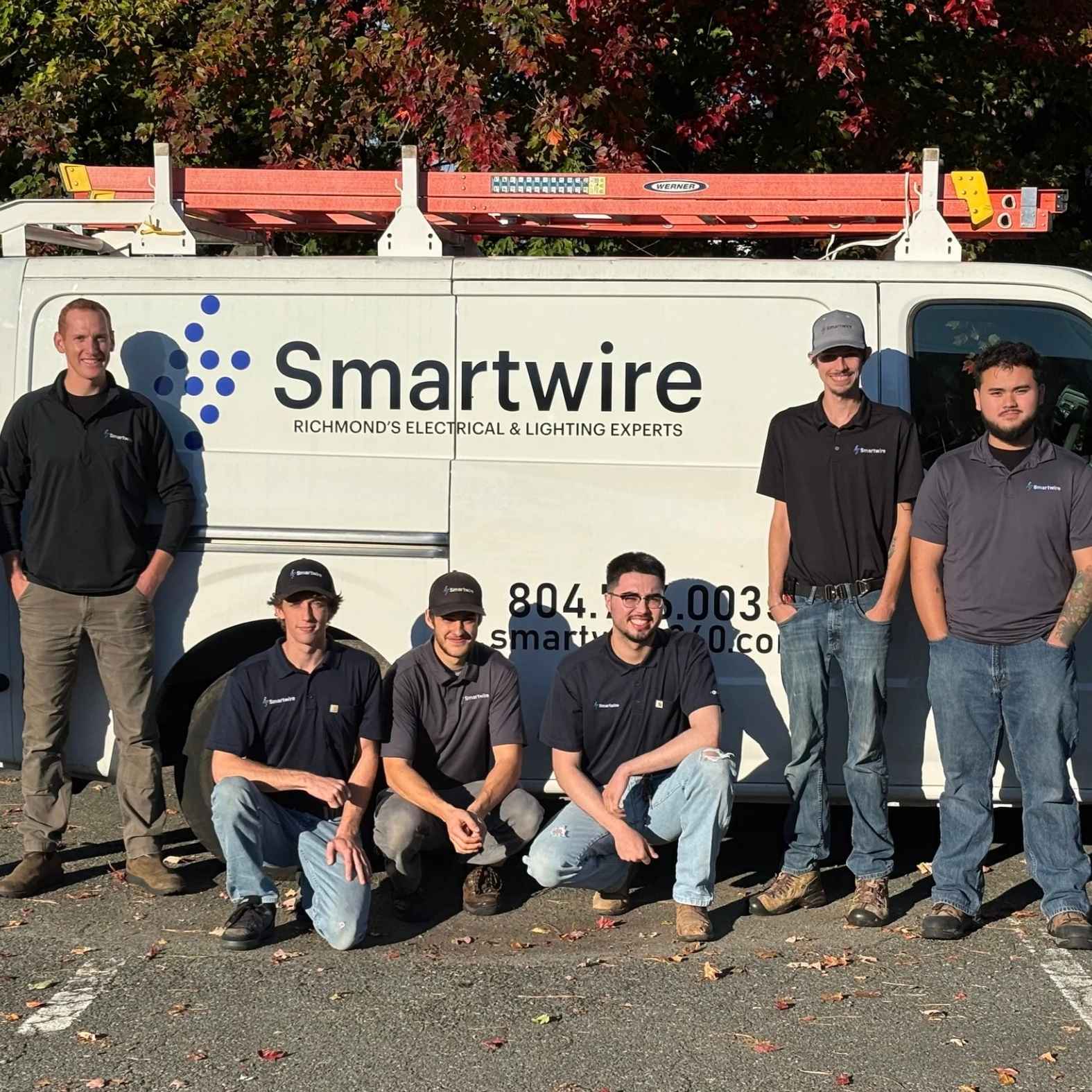 Smartwire electricians standing in front of truck