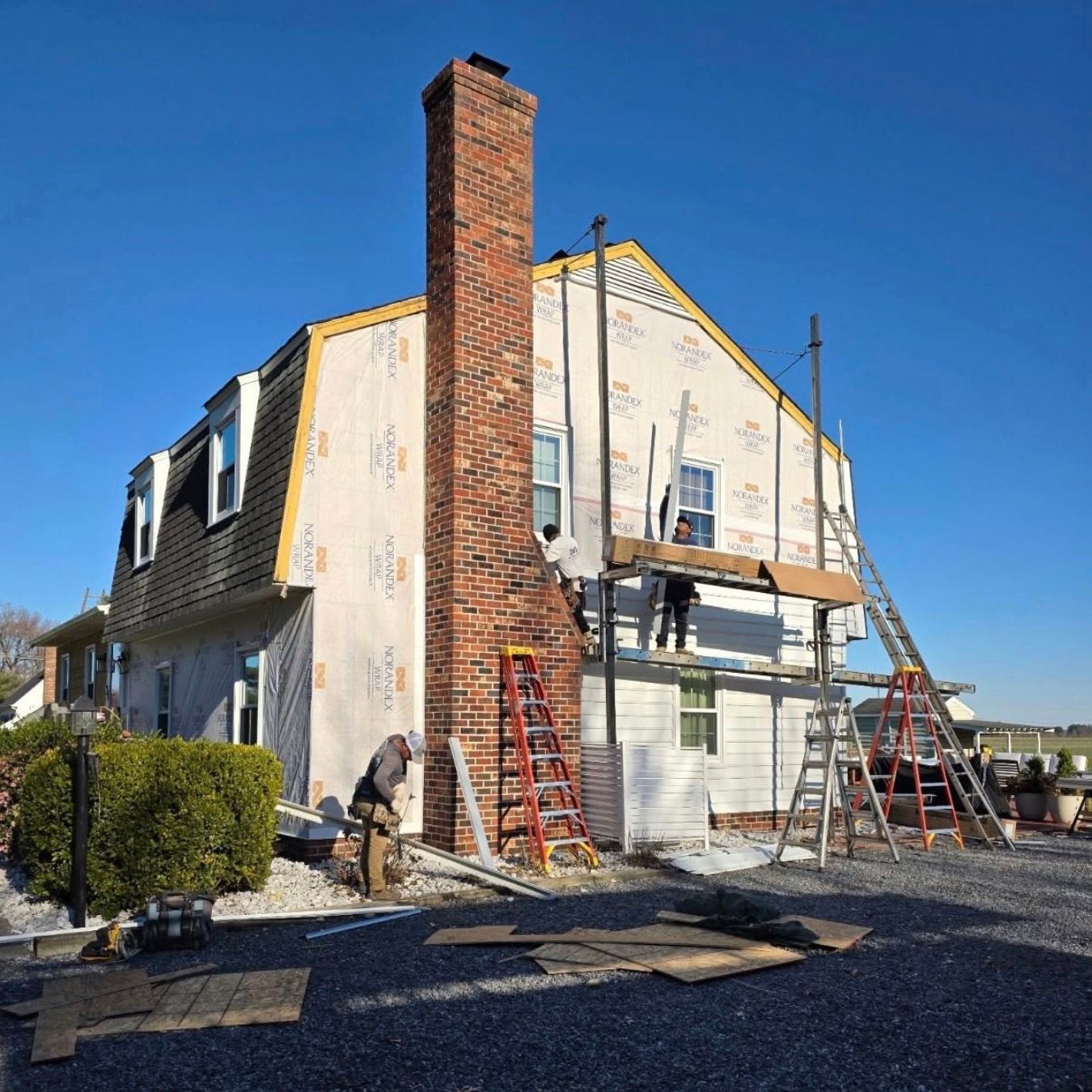 outdoor photo of renovation team working on home