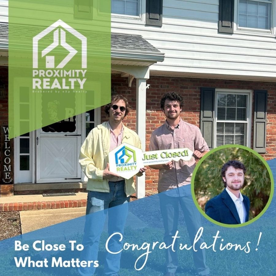 Brendan Easter standing in front of home with buyer holding key