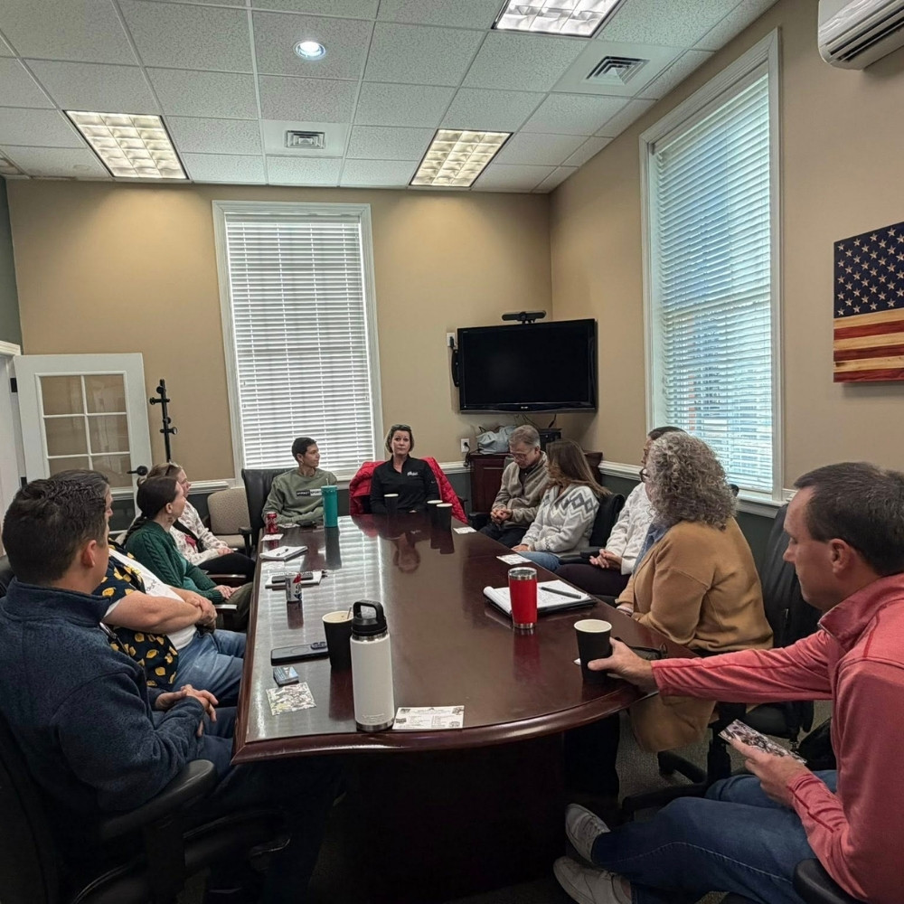 GROW Meeting with people sitting around a table