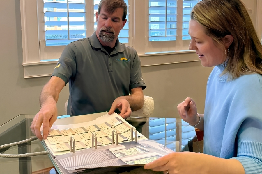 Blinds consultant showing samples to a client