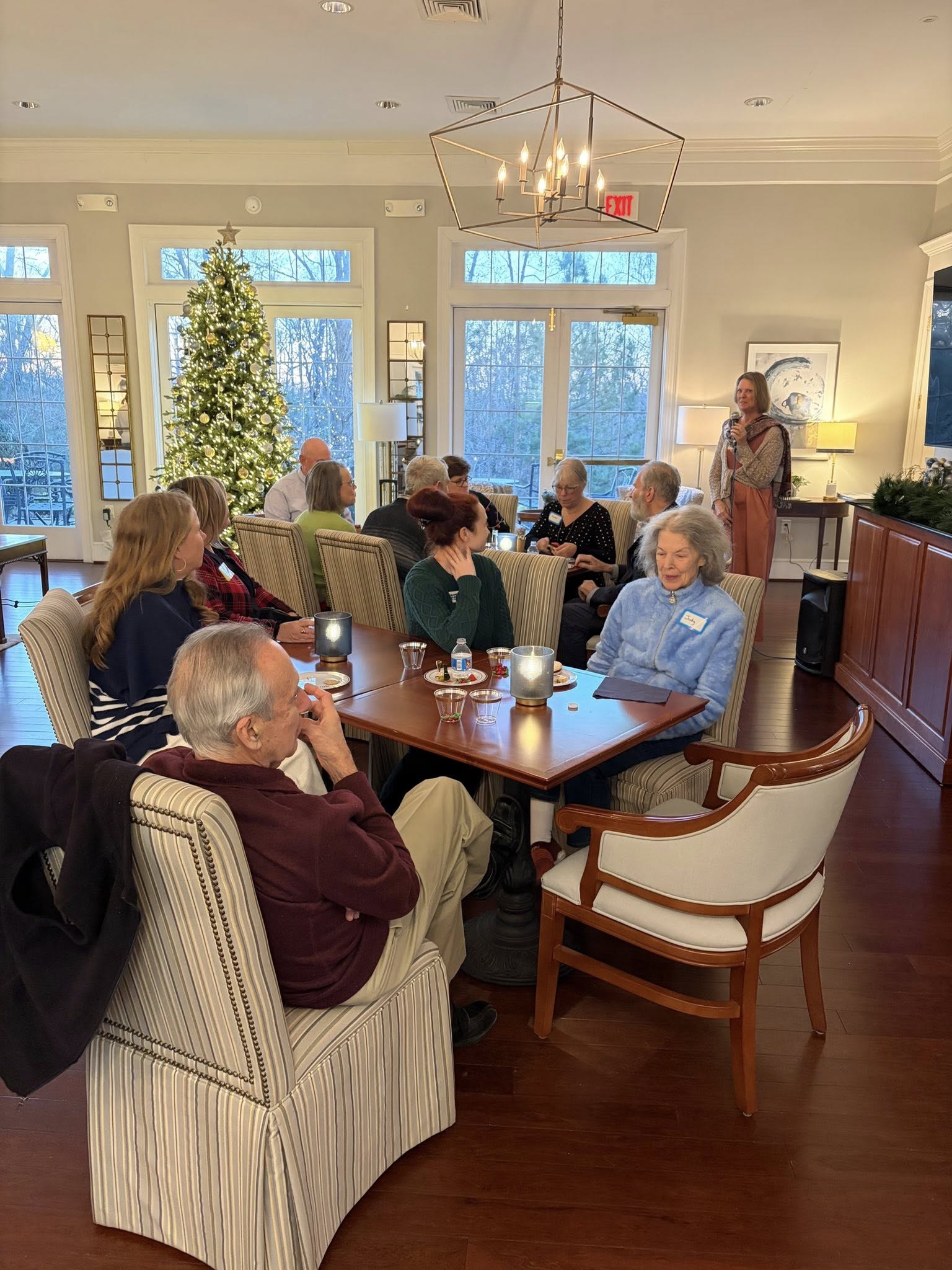 Elderly ladies sitting around table at retirement home