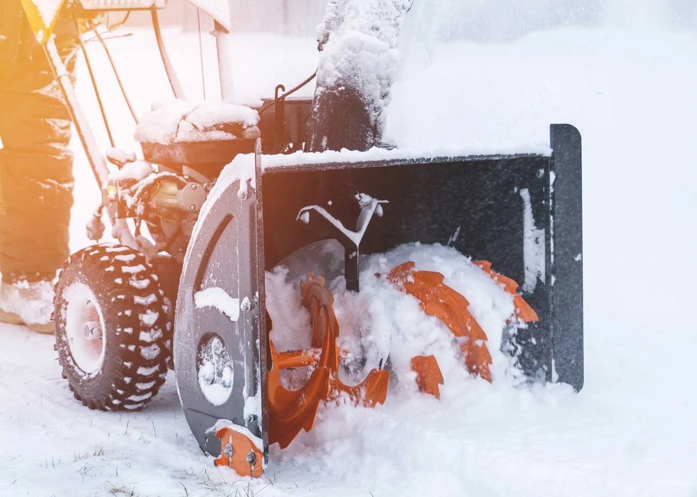 operator running snowblower