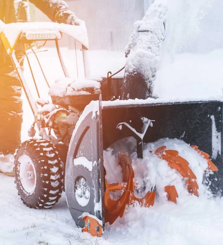 operator running snowblower