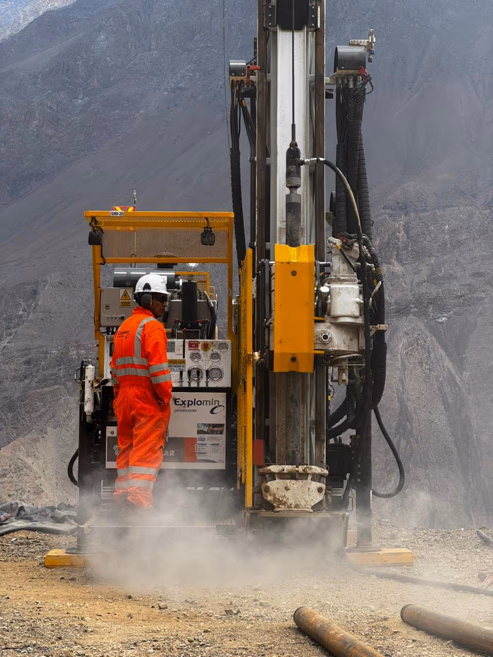 E29 worker using drilling equipment. 