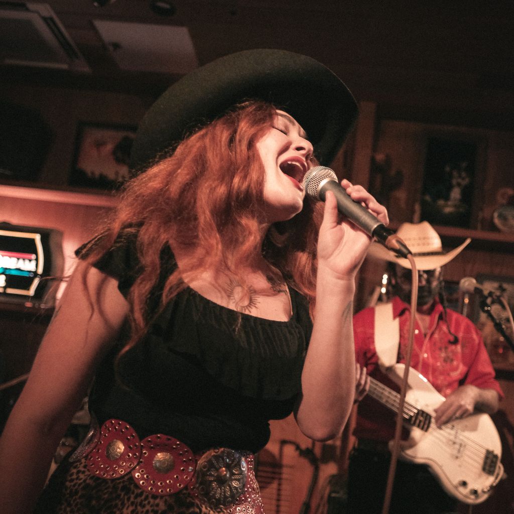 Woman Singing on Microphone