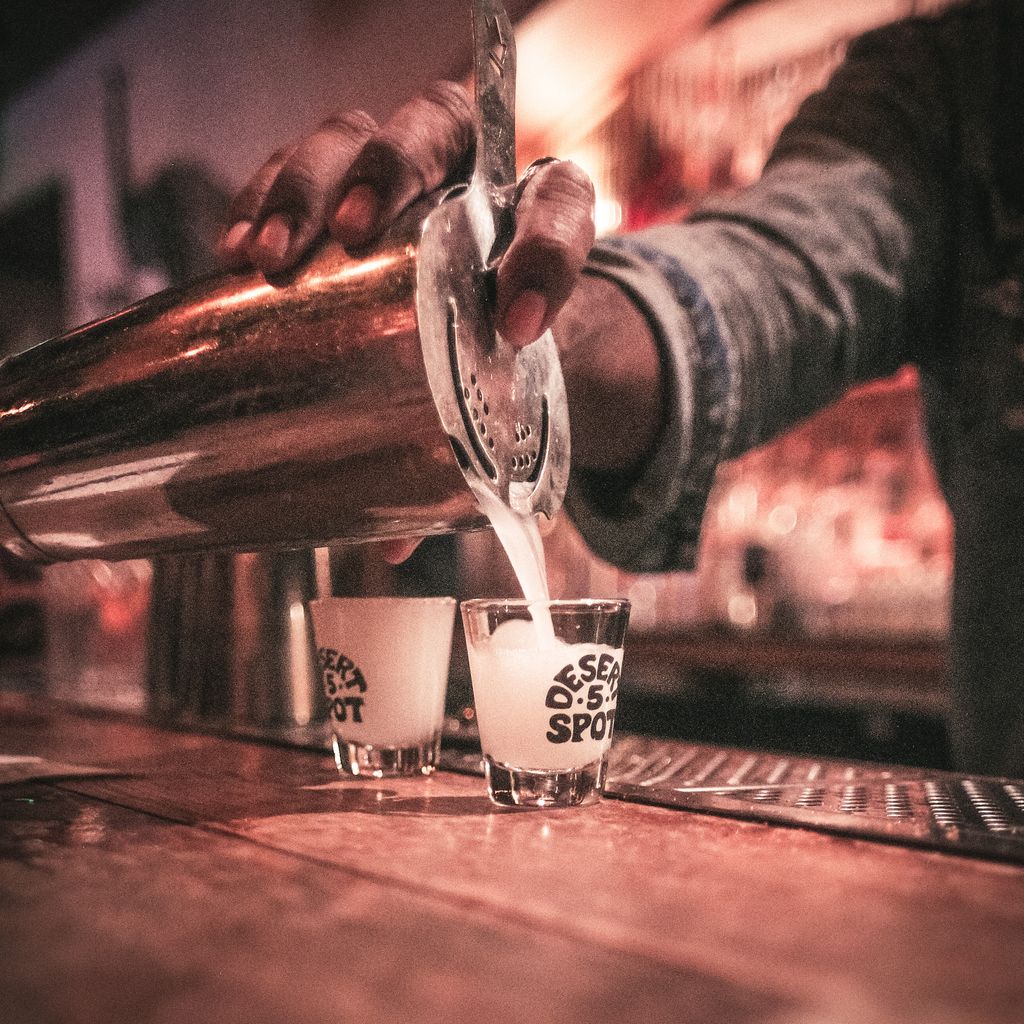 shots being poured at the bar