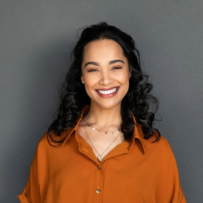 woman with dark hair smiling