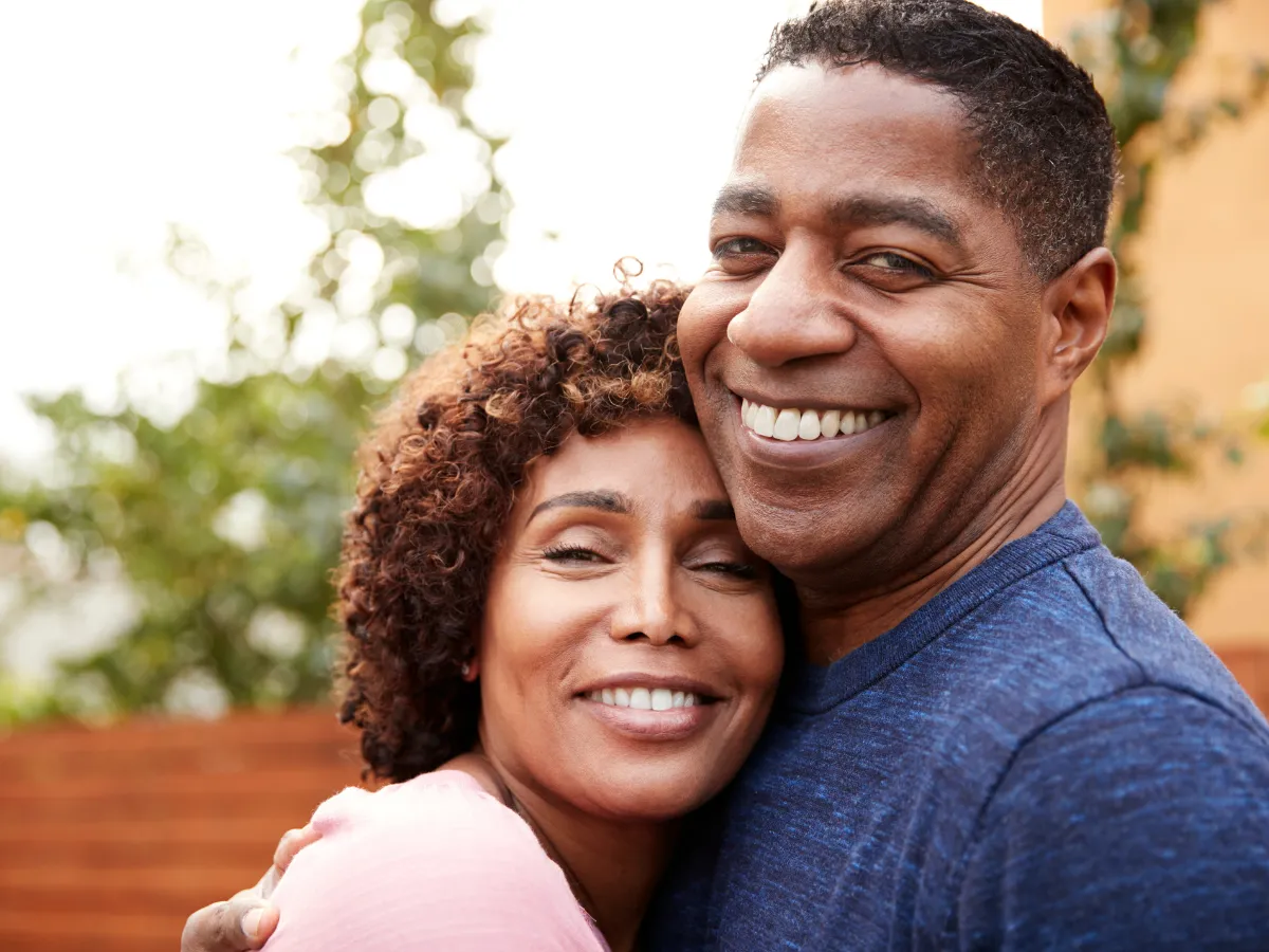 man and woman smiling