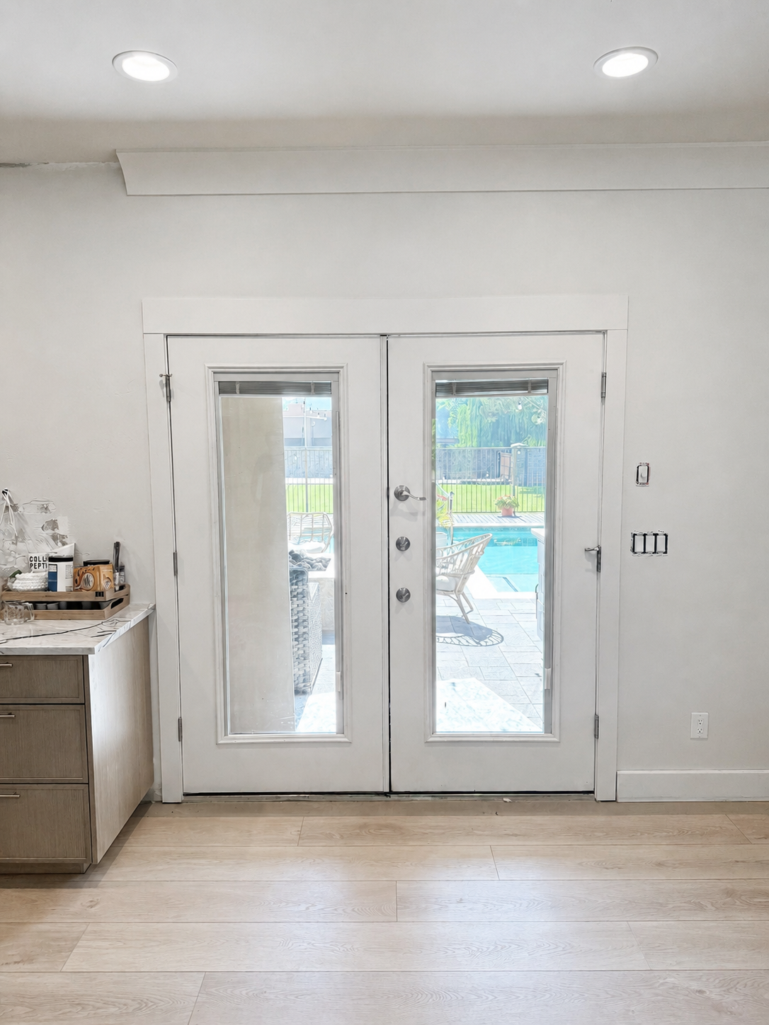 Original interior French doors before an 8-foot sliding glass door conversion