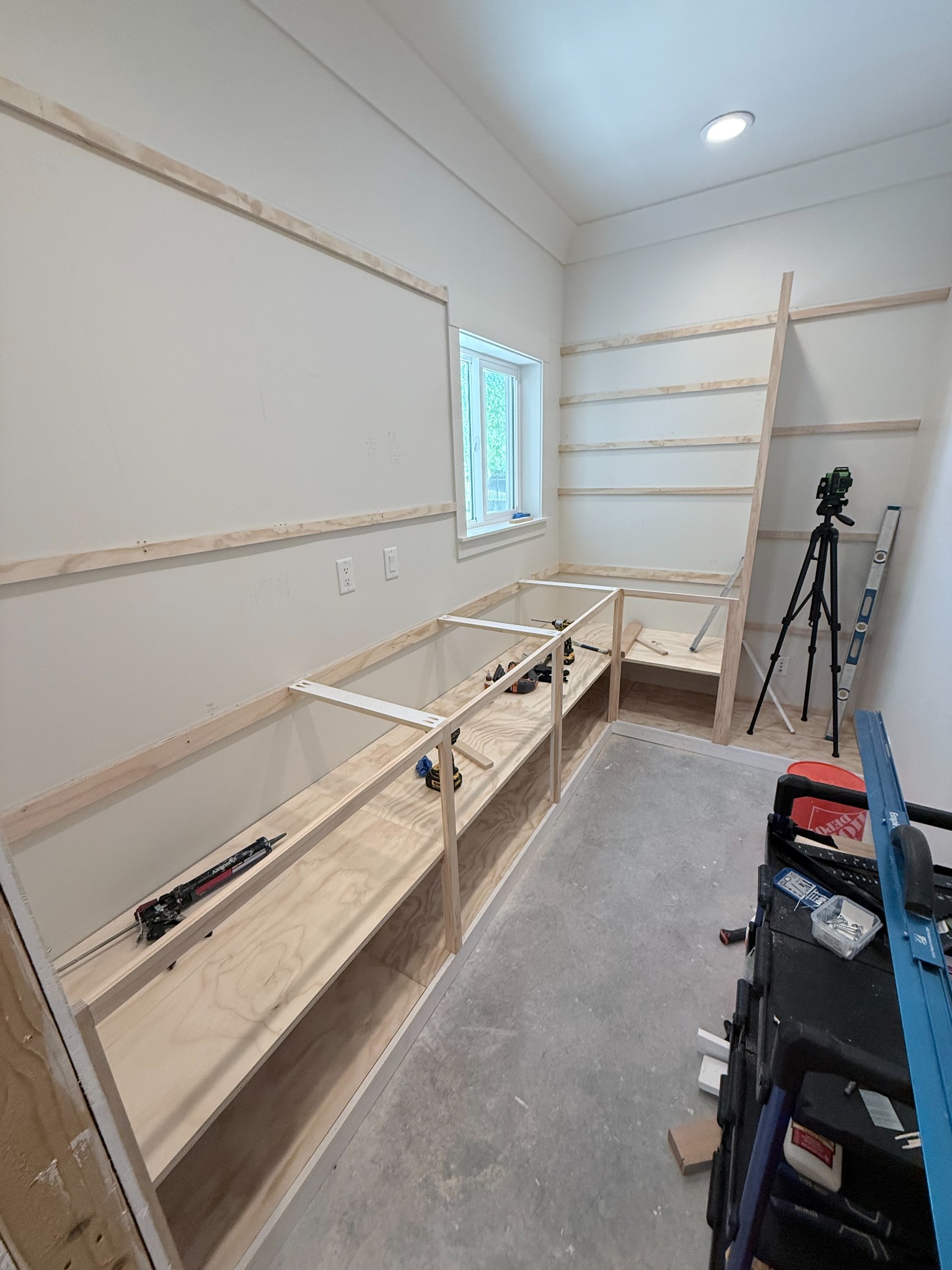 Custom pantry shelving and cabinet framing under construction