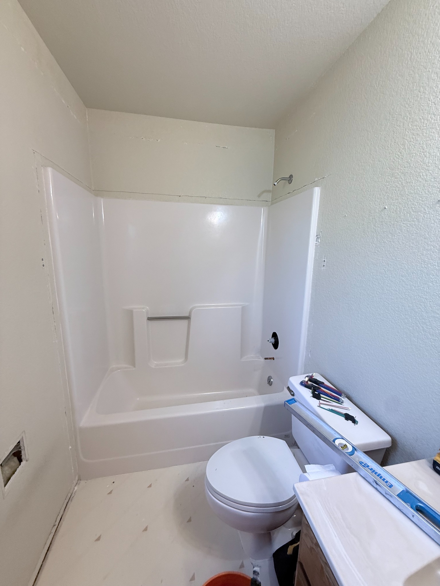 Original bathtub and surround before a tub-to-shower conversion in Cottonwood, Arizona